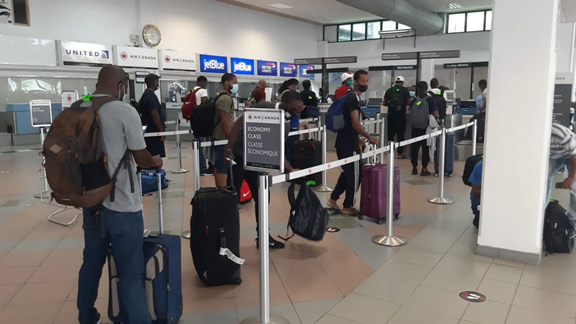 OECS nationals arrive in Toronto to work  on Canadian farms